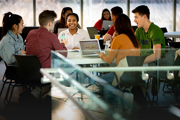 students at table collaborating