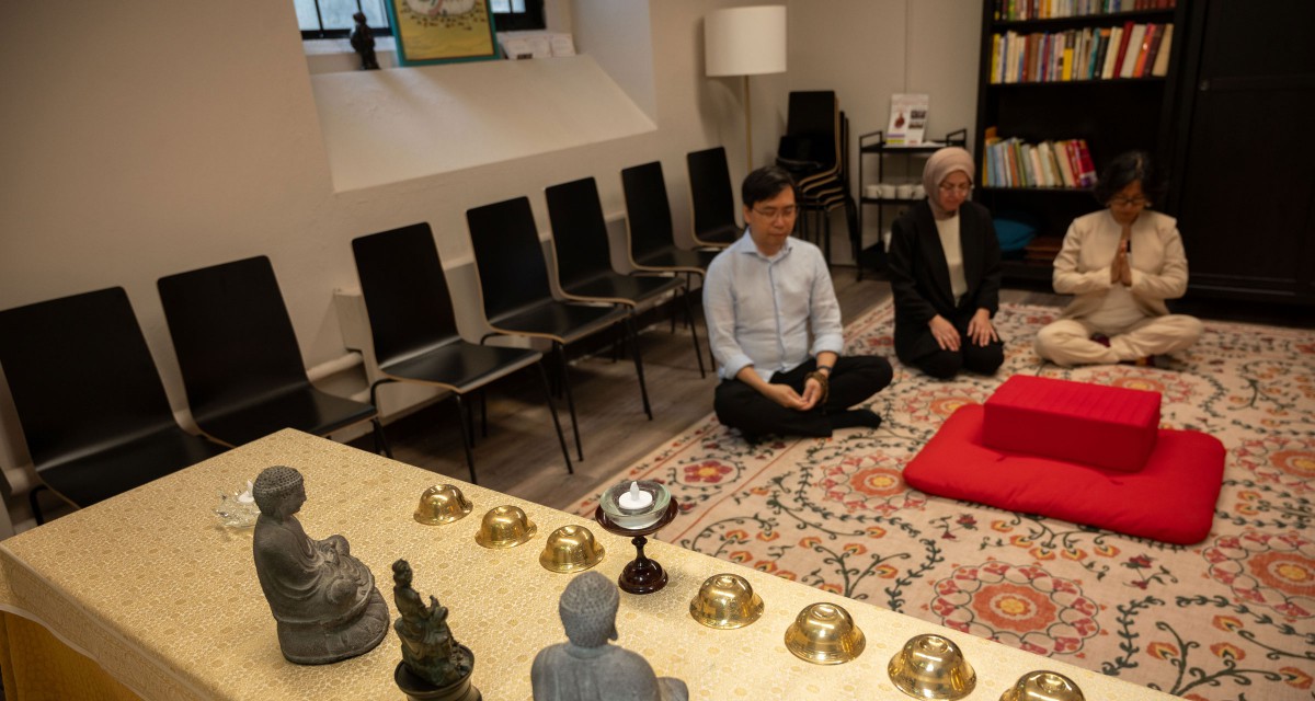 Professor Shiu, Professor Isgandarova and Principal Kim-Cragg gather together in the Buddhist Prayer Room. 