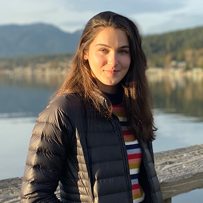 Laura Ashwood standing on a dock in the fall. 