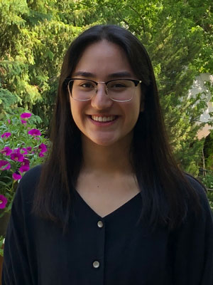 Hana Sharifi, a third-year student, wearing a blue blouse. 