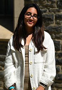 Armiti Zarbahsh standing in front of Old Vic.