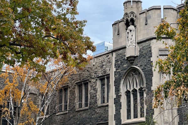 A statue of a young Queen Victoria perches above the portico at the front entrance to the Birge-Carnegie Library. 