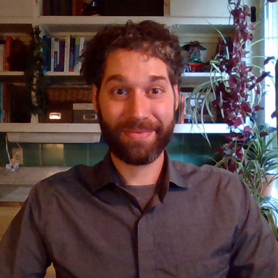 A man sitting in a home office. 